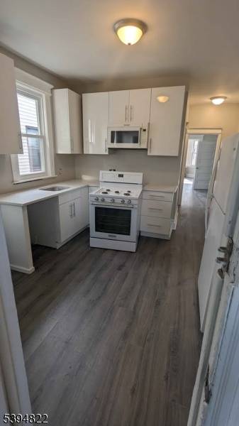 Recently updated two family home featuring 1 single and 1 two car garage.