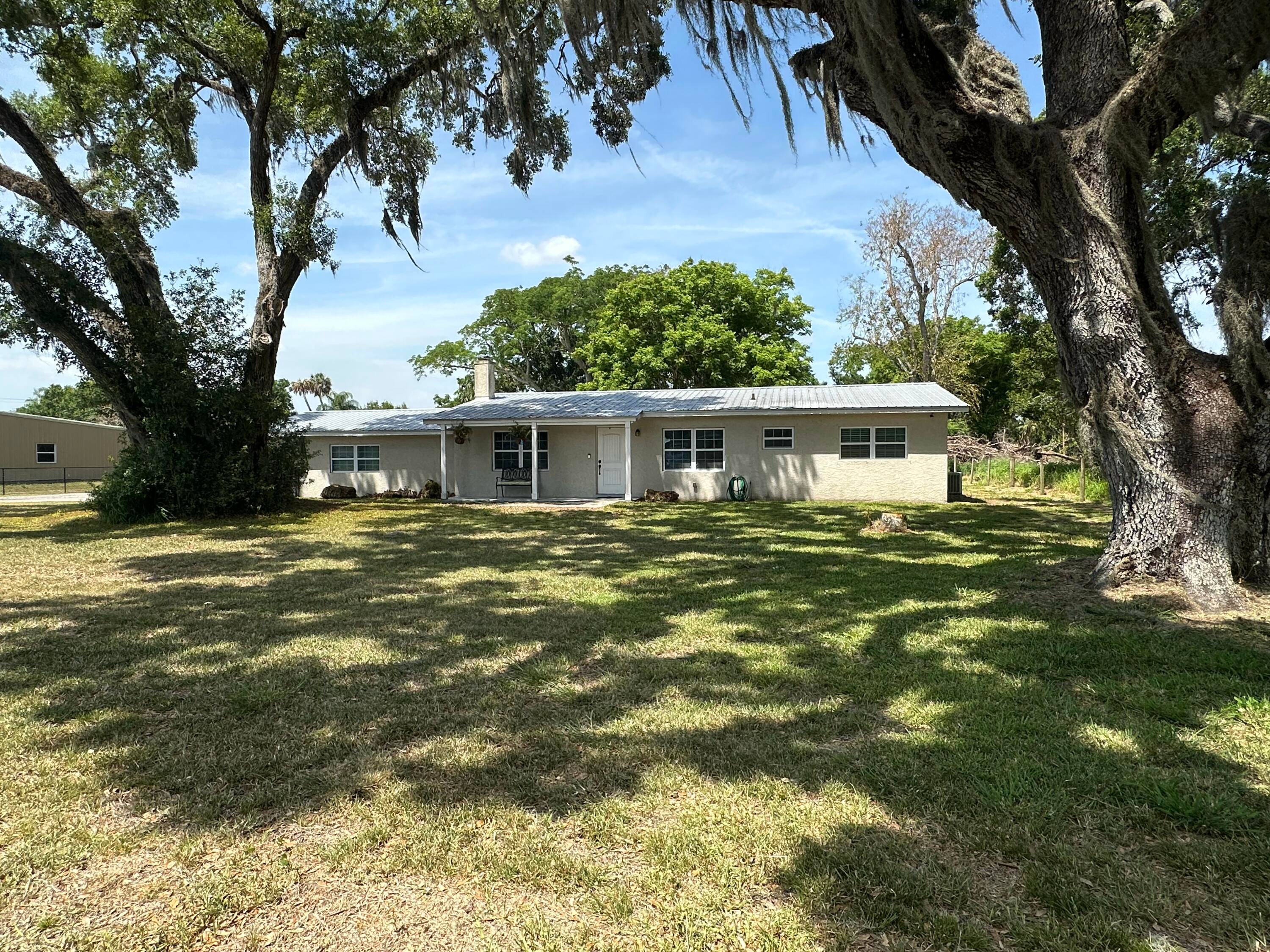 WELCOME TO THIS STUNNING REMODELED 3BD 2 BA HOME NESTLED ON A SPACIOUS HALF ACRE LOT.