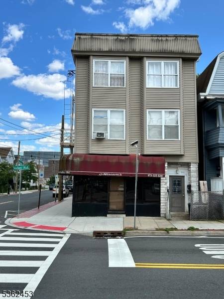 The five unit multi family Commercial building consists of a spacious storefront, ideal for retail or dining, with large glass windows that invite foot traffic.