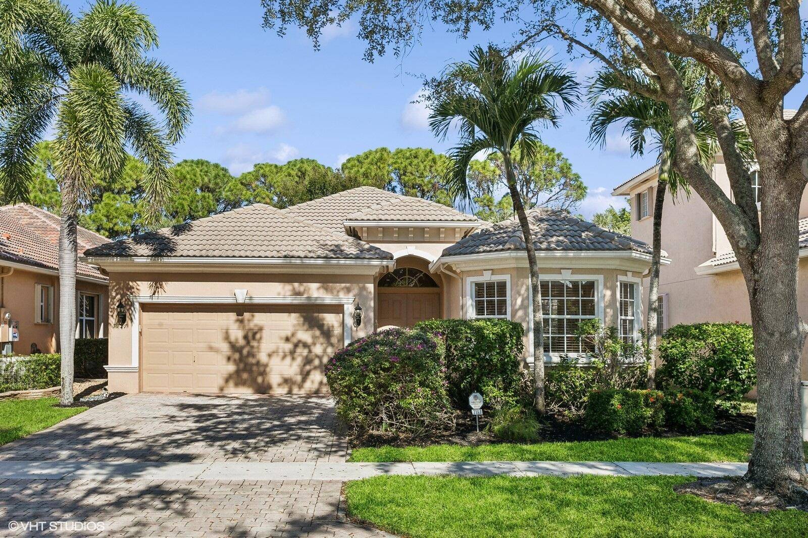 Discover the elegance of this lovely Alicante model, nestled in the 55 community of Mizner Falls.