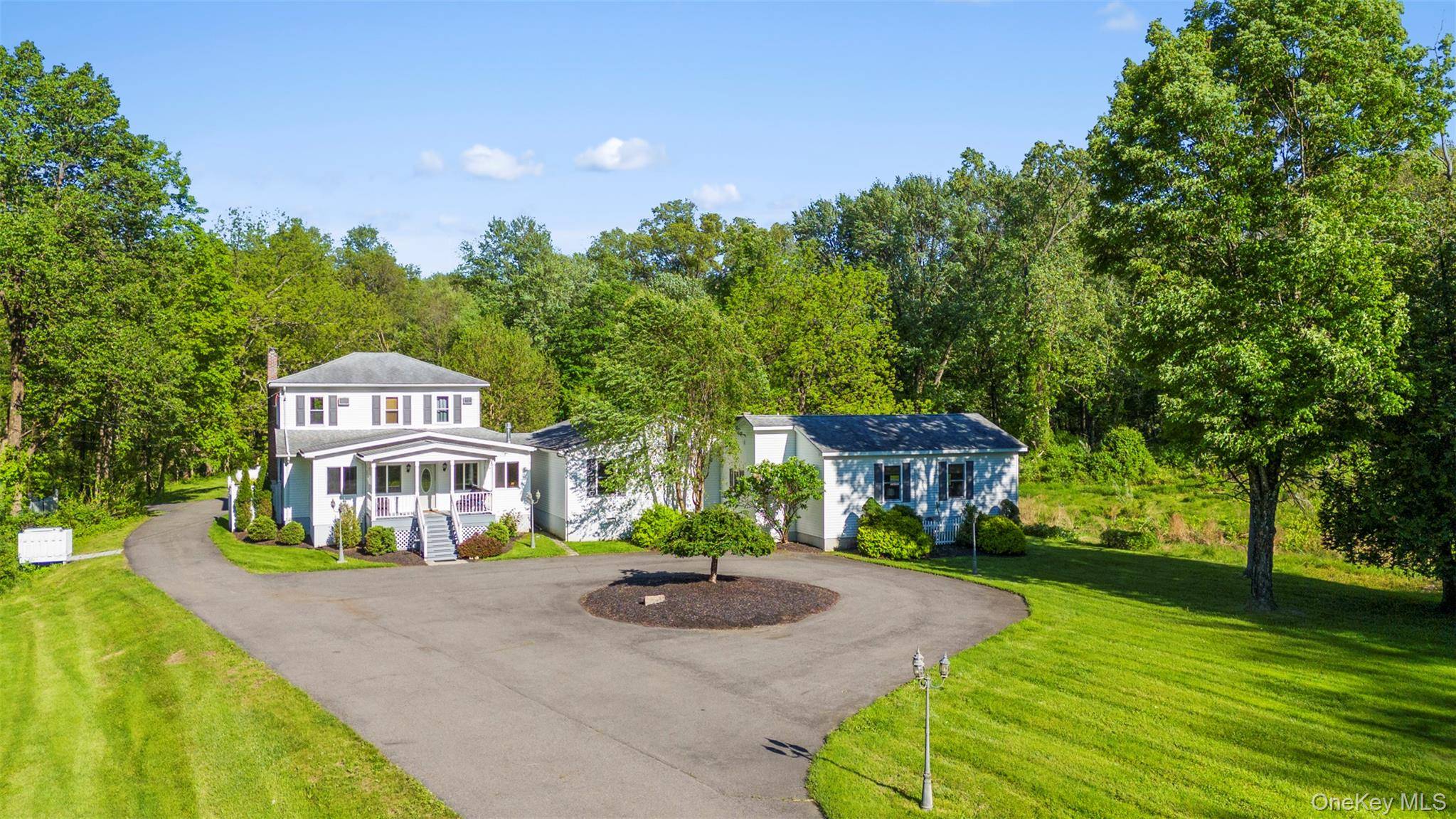 Set on nearly 20 secluded acres, this thoughtfully designed home is just minutes from the vibrant centers of New Paltz, Rosendale, and Stone Ridge.