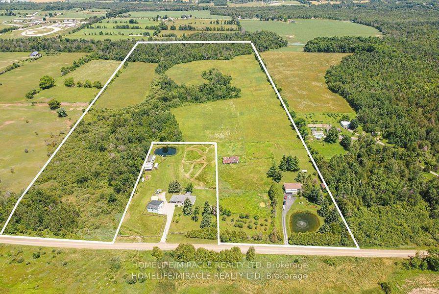 Opportunity to own 47 acres with a beautifully landscaped raised bungalow.