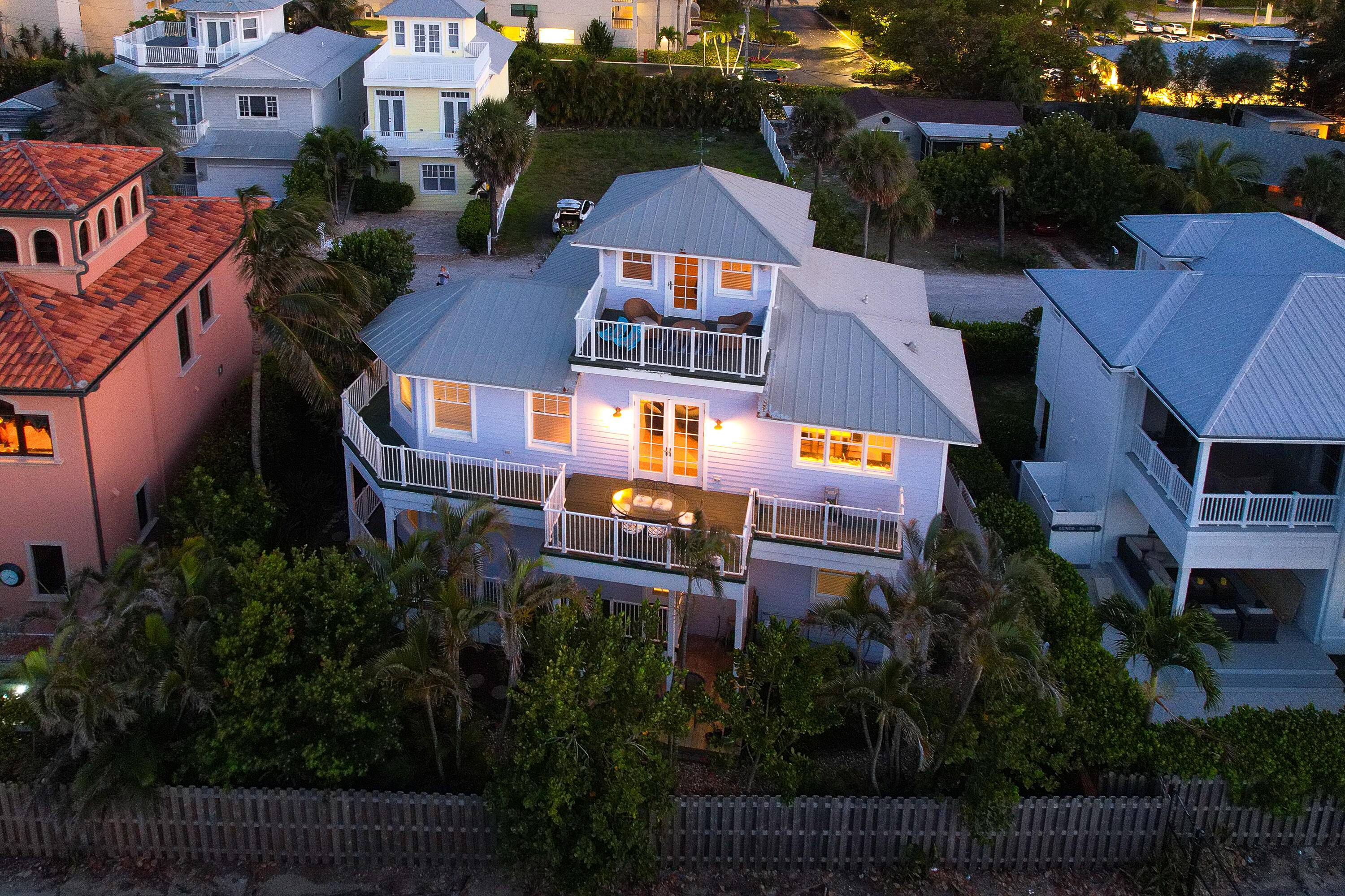 Introducing your perfect coastal haven, a remarkable three story retreat that doubles as a highly profitable AirBnB.
