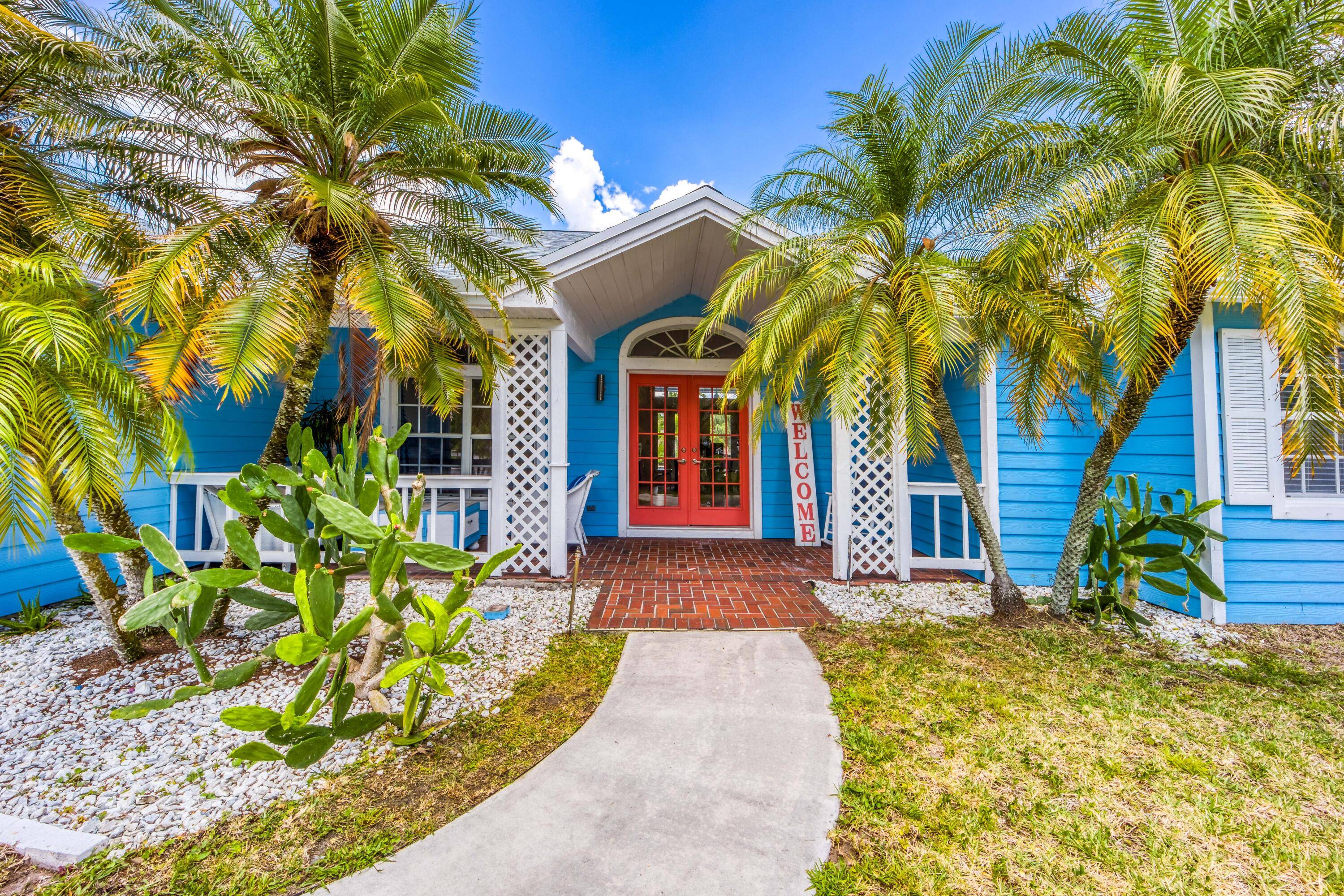 Stunning single level CBS pool home with brand new roof, located on a large private lot in the highly desirable Pinecrest Lakes community of Jensen Beach.