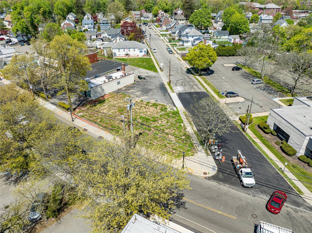 Property consists of 2 areas spot for building and seperate parking lot along side of laundromat for parking located on Main street.