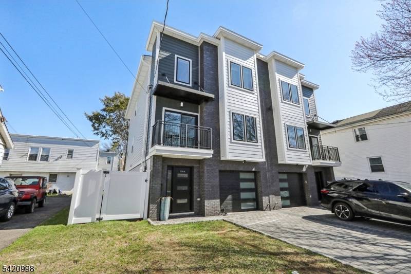 Beautifully maintained one family duplex style home featuring a 1 car garage and private driveway.