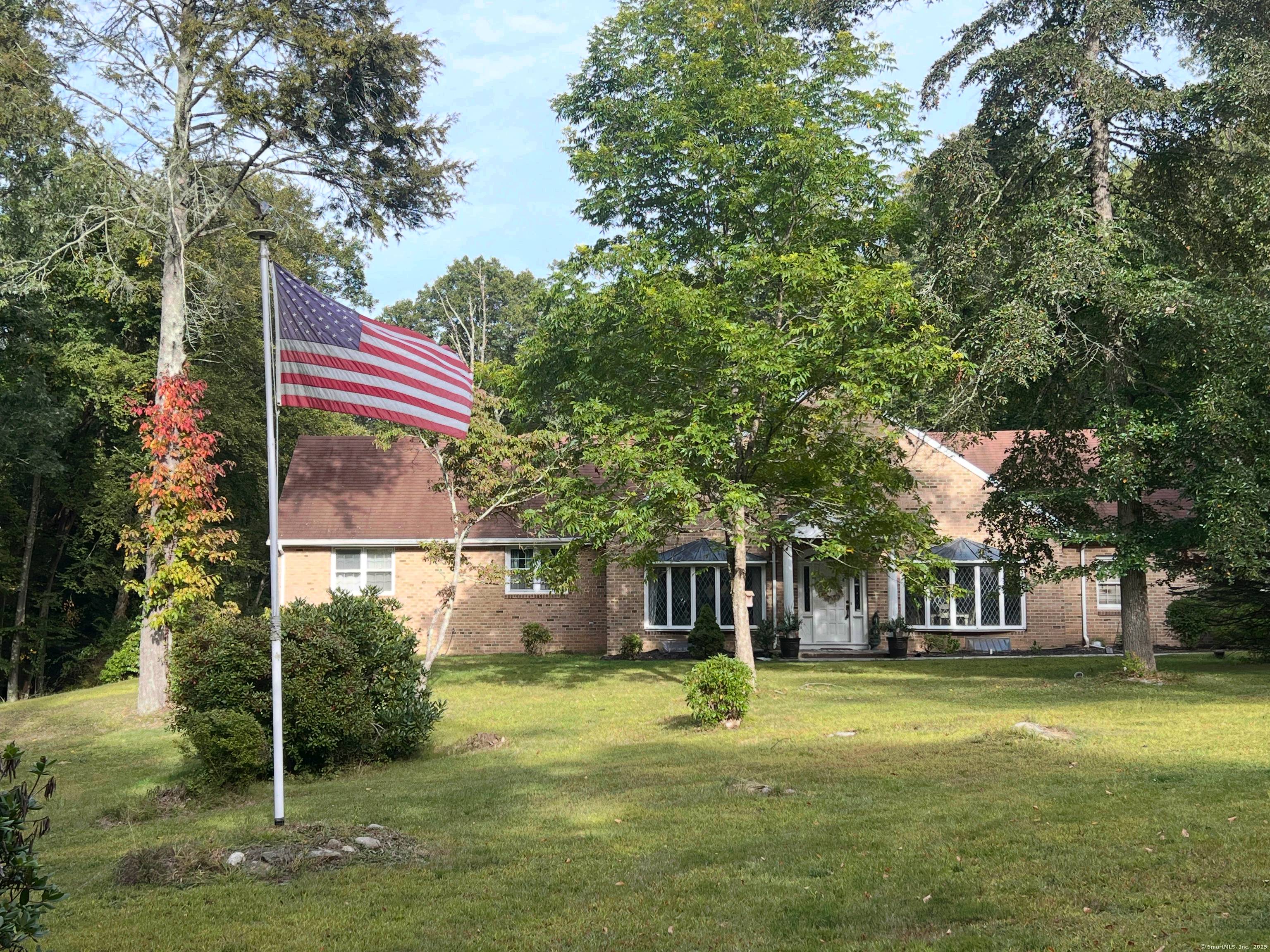 At 153 Meeting House Road in Haddam, discover a private brick ranch where timeless design meets everyday comfort.