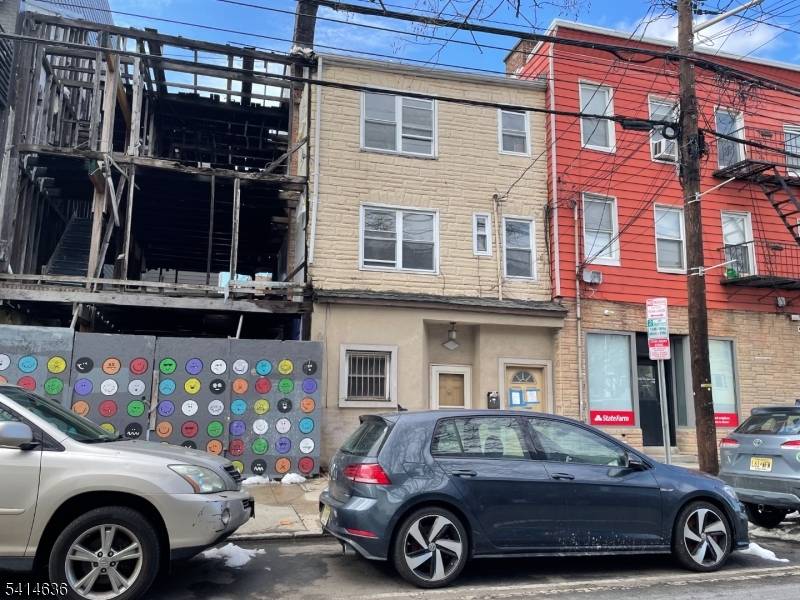 Prime Downtown Jersey City 3 family brick property featuring three 1BR 1BA units.