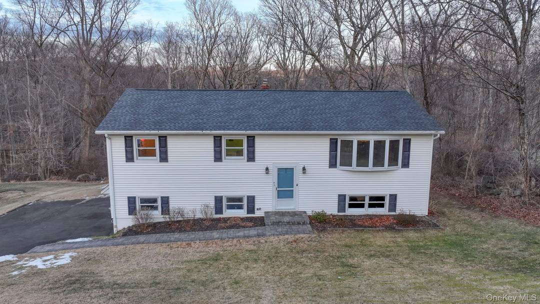 In Danbury, there is a 4 bedroom, 1 full and 2 half bath raised ranch offering 2, 196 square feet of comfortable living space, set on a spacious 0.