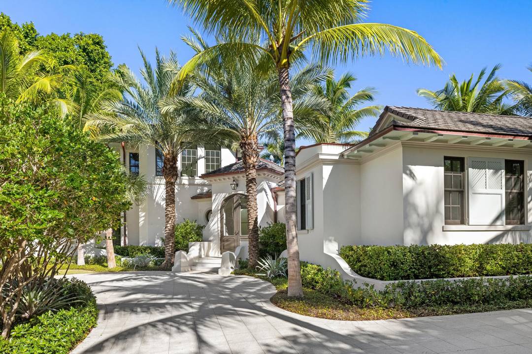 Tucked away on a quiet cul de sac on one of Palm Beach's most desirable in town streets, this custom brand new residence offers privacy, scale, and refined craftsmanship.