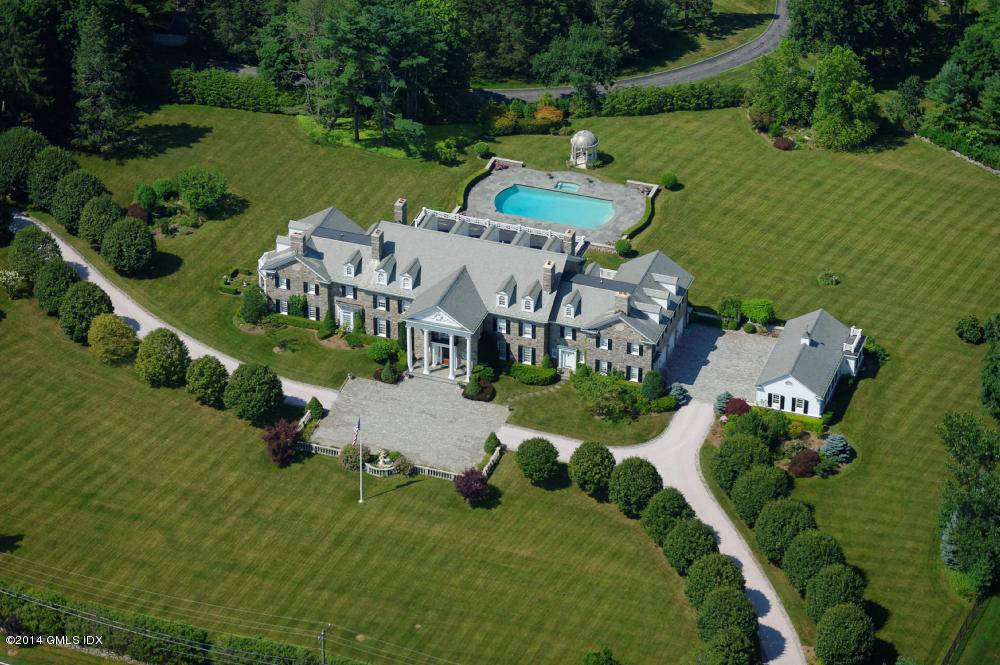 Parklike Estate in Greenwich, CT Breathtaking sunsets and formal gardens inspire a magnificent Georgian Colonial stone estate house located 560 feet high above sea level on 4.
