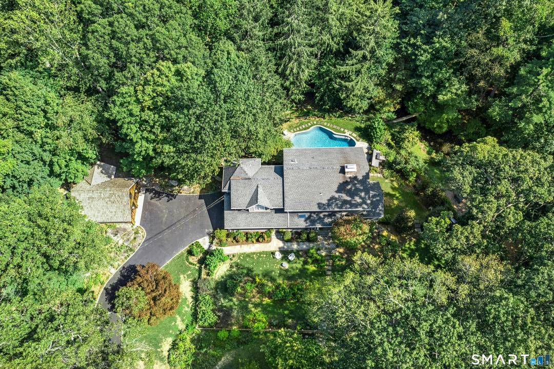 Rarely do you find a property that has it all a spacious move in ready house with a pool, and a private one acre parcel close to everything Darien has ...