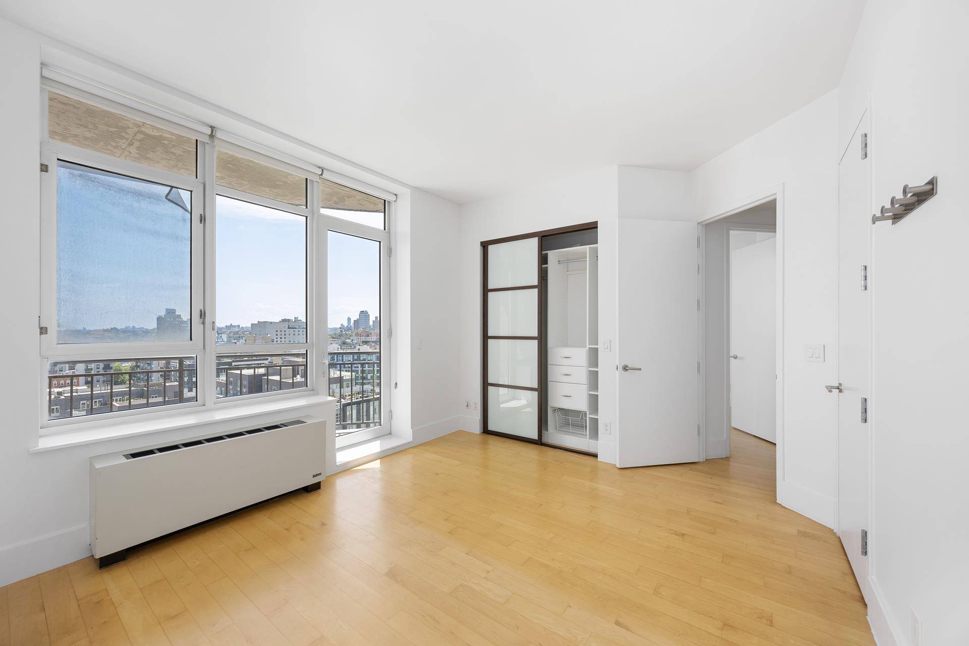 Perched high on the 11th floor of one of Williamsburg's most coveted full service condominiums, Residence 11D at 20 Bayard Street offers a rare combination of style, light, and breathtaking ...