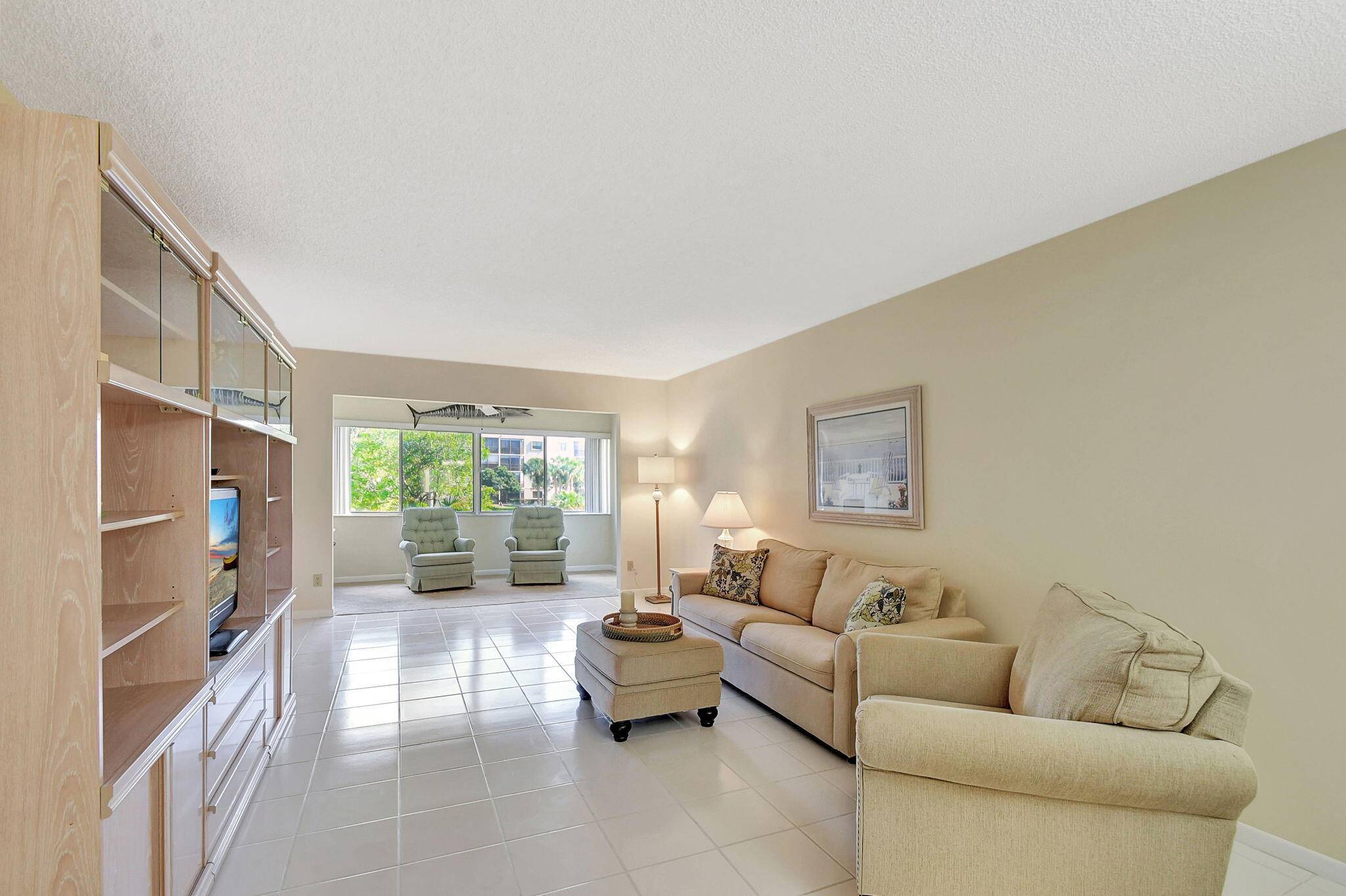 JUST BRING YOUR TOOTHBRUSH TO THIS SPARKLING, FRESHLY PAINTED, SPACIOUS CONDO WITH ATTRACTIVE TILE FLOORING EXCEPT MBR FL.