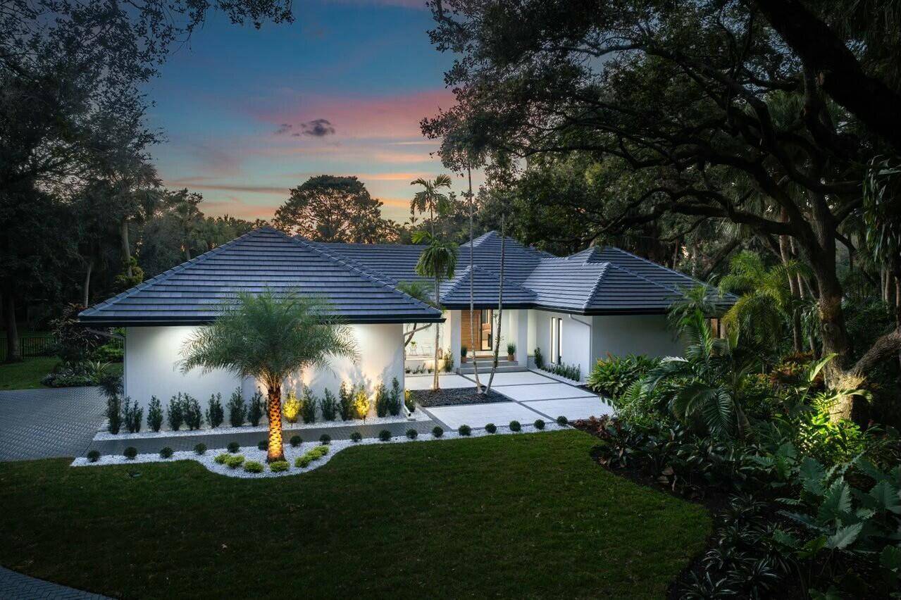 This fully reimagined contemporary gem is nestled in the prestigious Foxe Chase community, offering a perfect blend of modern luxury and serene privacy on over an acre of land.