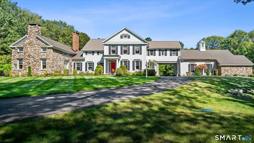 Set high atop the sought after West Simsbury ridgeline, this stunning country estate is privately nestled on four acres of sweeping, picturesque landscape.