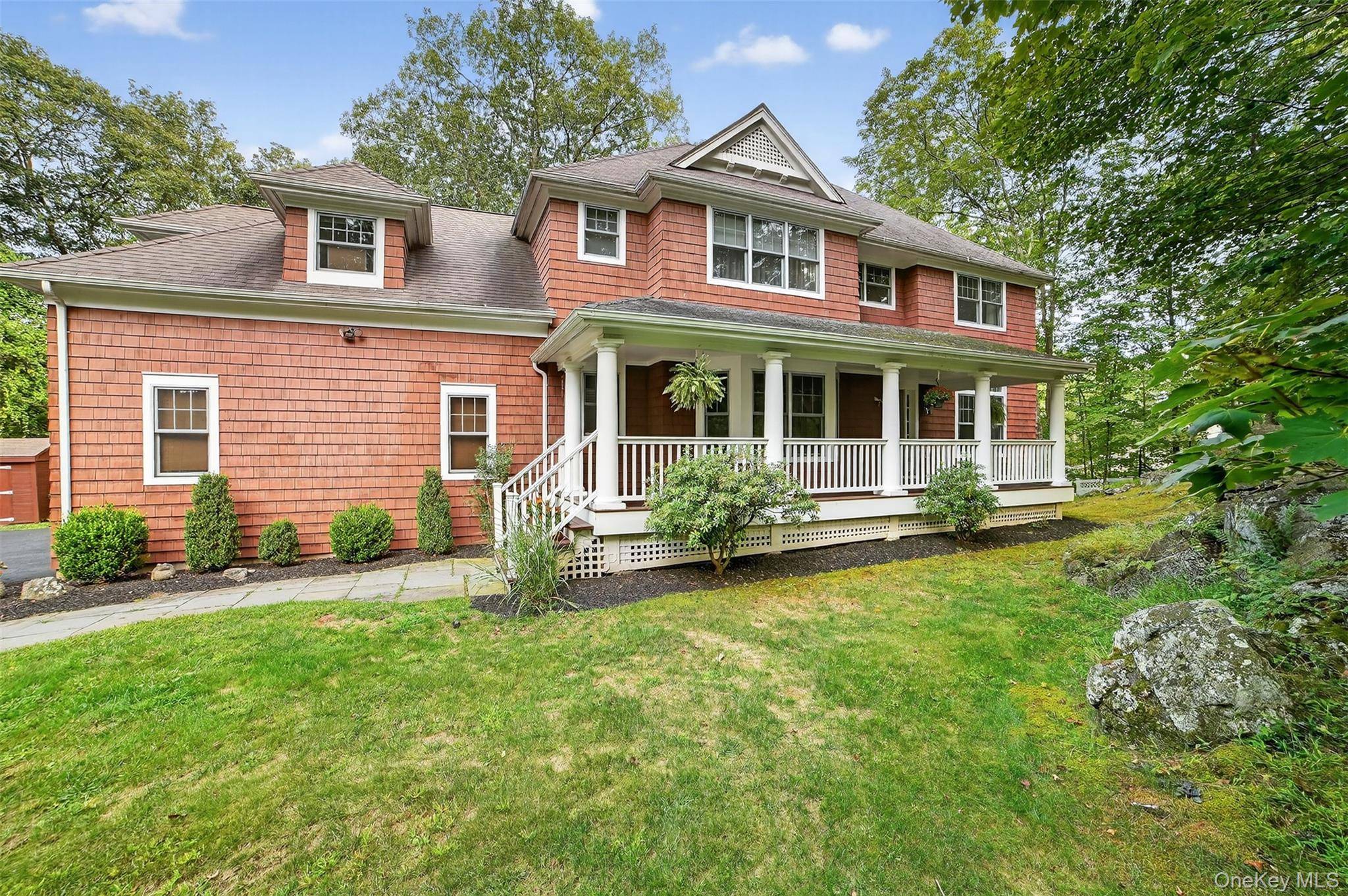 This Stunning Front Porch Center Hall Colonial sits majestically on beautifully landscaped parklike property in the cul de sac with a spectacular approach.