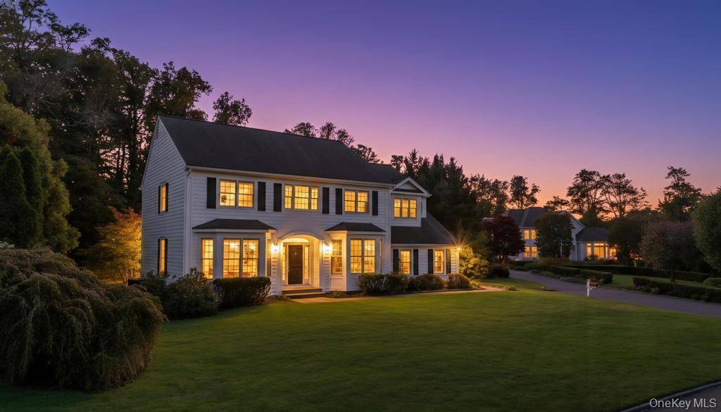 Welcome to 9 Tappanwood Drive, a stunning colonial in the esteemed gated community of Lattingtown Preserve.
