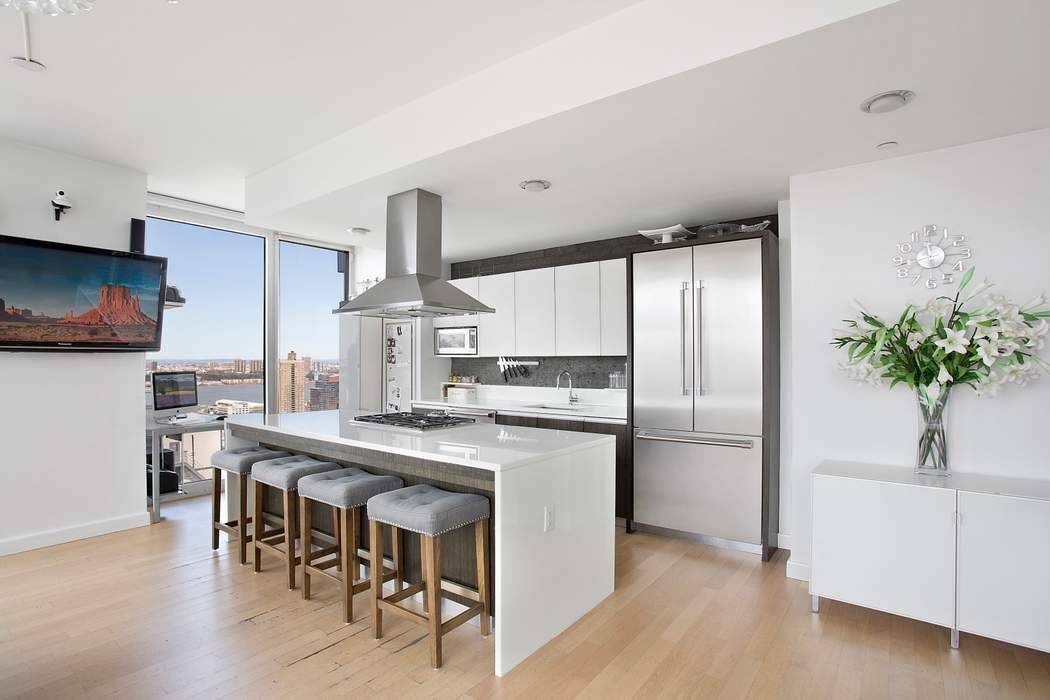 Perched high in the highly sought after Platinum Condominium, this coveted southwest facing corner residence offers an exceptional blend of luxury, privacy, and panoramic city views.