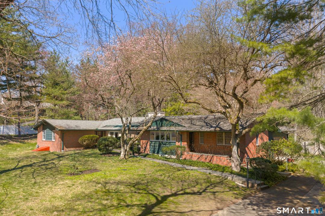 Set on over 1. 5 private acres in a sought after Stamford location near the Greenwich line and surrounded by multimillion dollar homes, this mid century modern ranch offers architectural ...
