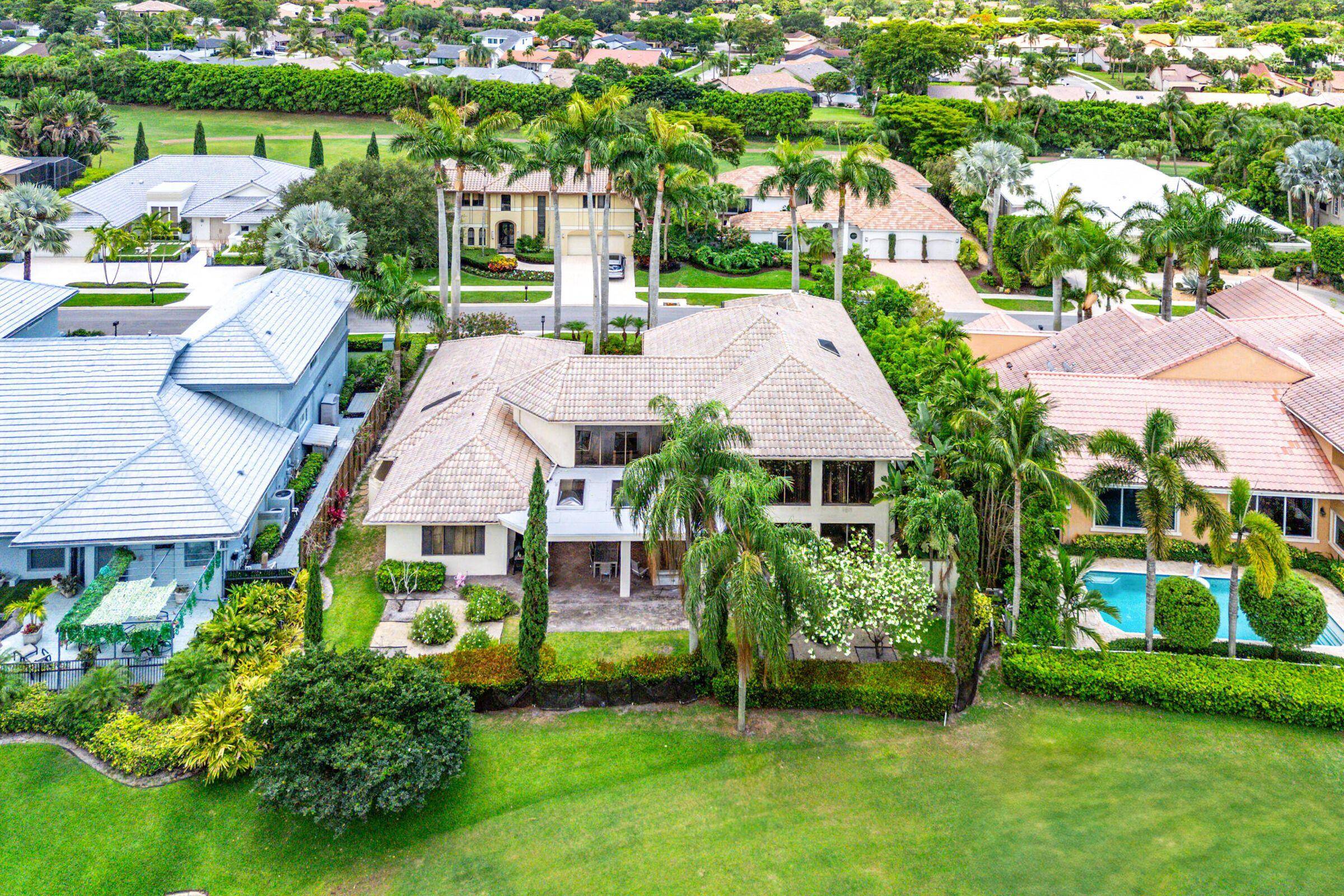 Enter through stately iron gates into a private courtyard.