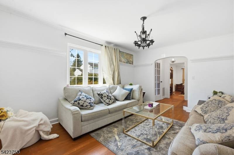 Located in the highly sought after Upper Elmora Hills section of Elizabeth, this stunning Tudor style home sits on a prime corner lot and offers timeless charm with modern comfort.