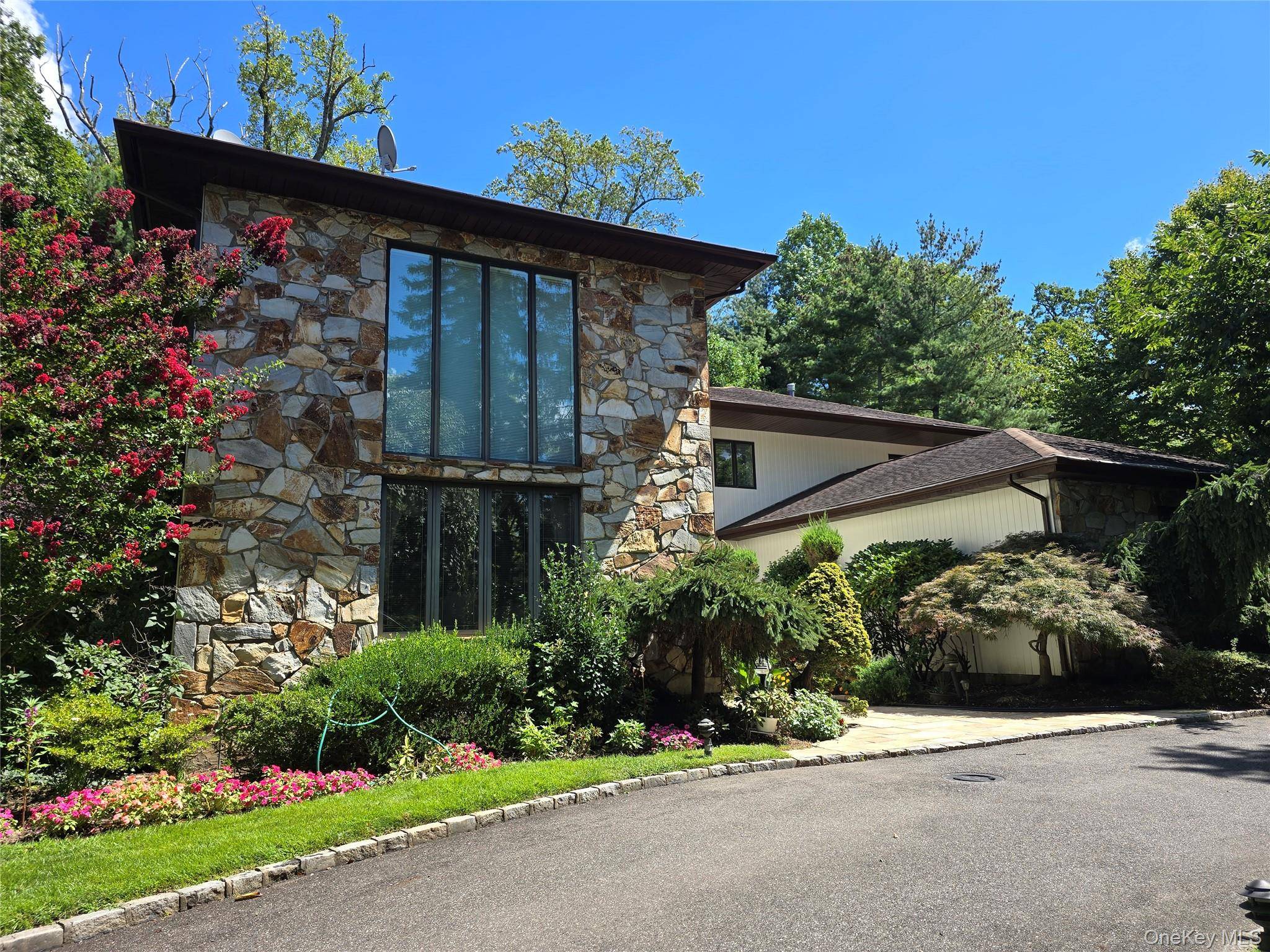 This Contemporary Colonial Style Home Features 5 Bedrooms, 4 Full Baths and Two Half Bath.