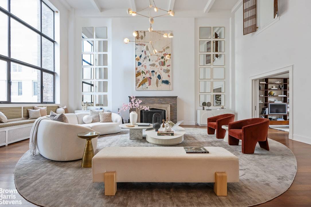 A dramatic and spectacular penthouse apartment with 20 foot ceilings and a large square terrace.