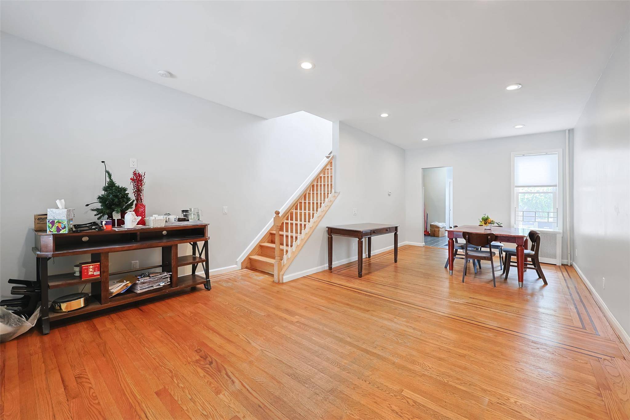 Welcome to this surprisingly spacious townhouse in Middle Village !