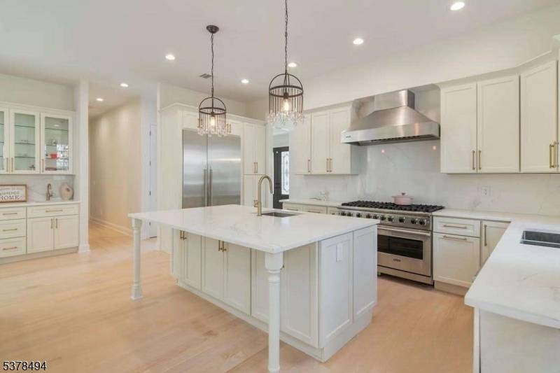 Be prepared to fall in love with this extraordinary 6 bedroom Colonial masterpiece, newly built in 2022, perfectly nestled on a quiet loop road in Summit's most desirable neighborhood.