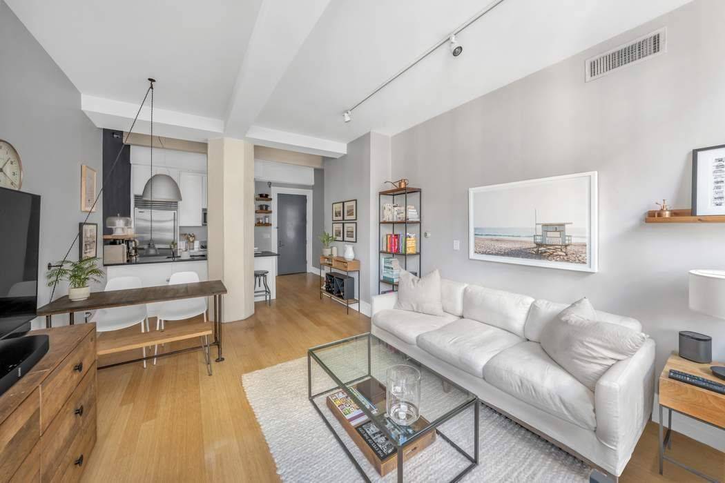 This quintessential DUMBO loft seamlessly combines modern living and comfort.