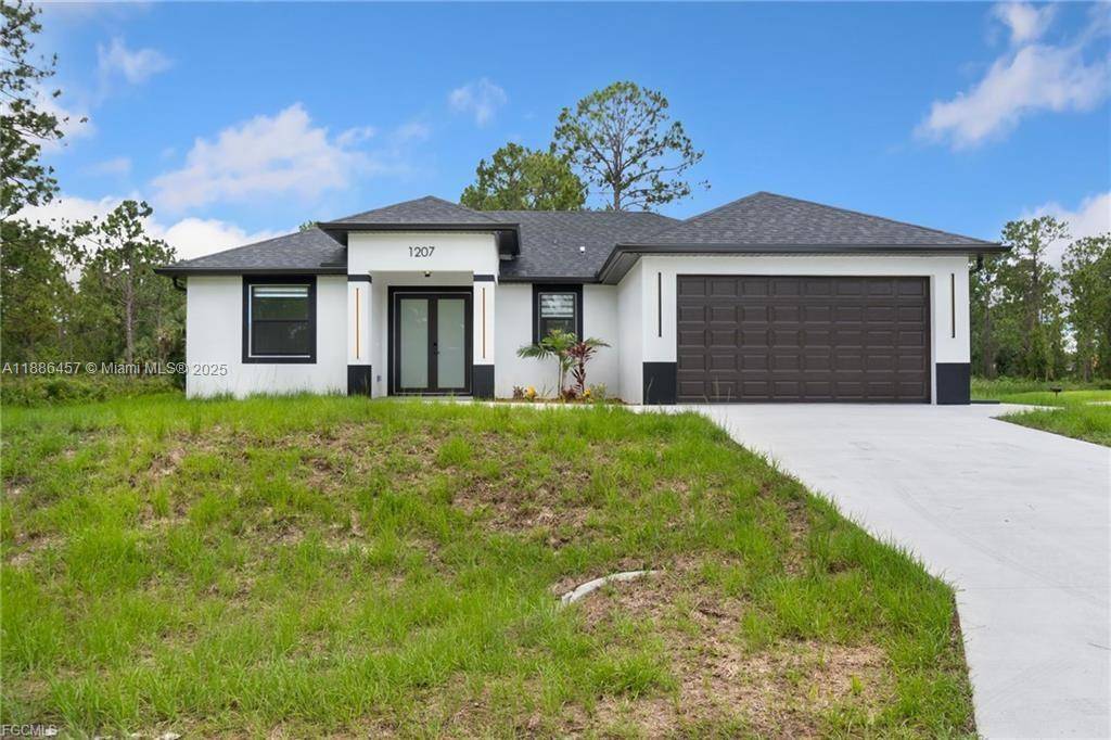 Welcome to an exceptional new construction residence in the heart of Lehigh Acres, where contemporary luxury meets thoughtful design.