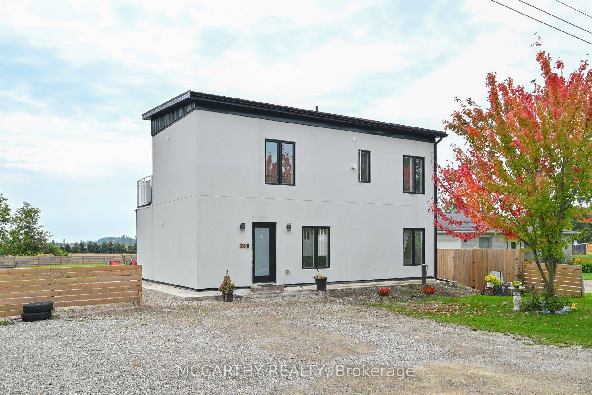 Unique 2 story house, white stucco exterior, Modern Flat Sloped Roof, New build, 4 Bedroom 3 bath, large back yard, with garden shed.