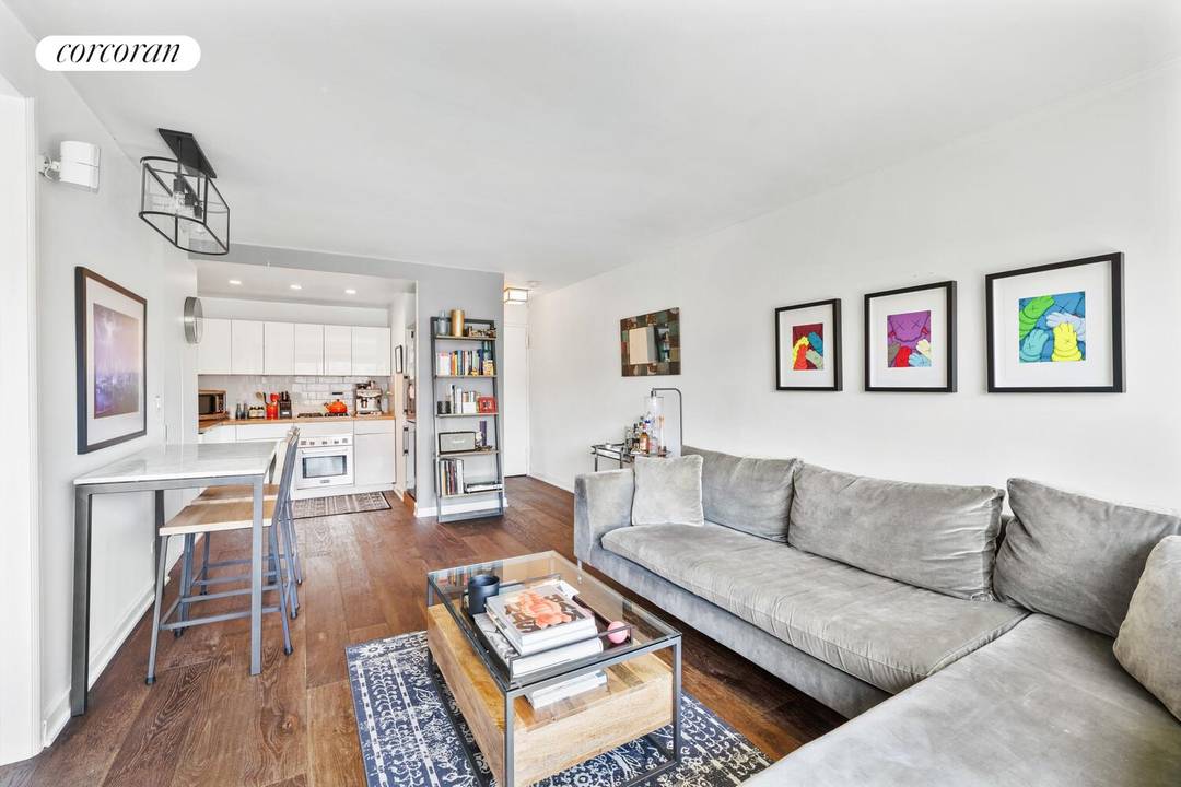 Experience southern light and sweeping city views from this high floor one bedroom home at 201 West 21st Street, Apartment 12J, in the heart of Chelsea.