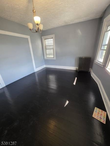 Discover the perfect addition to your investment portfolio with this spacious and well maintained 3 family home in the heart of East Orange.