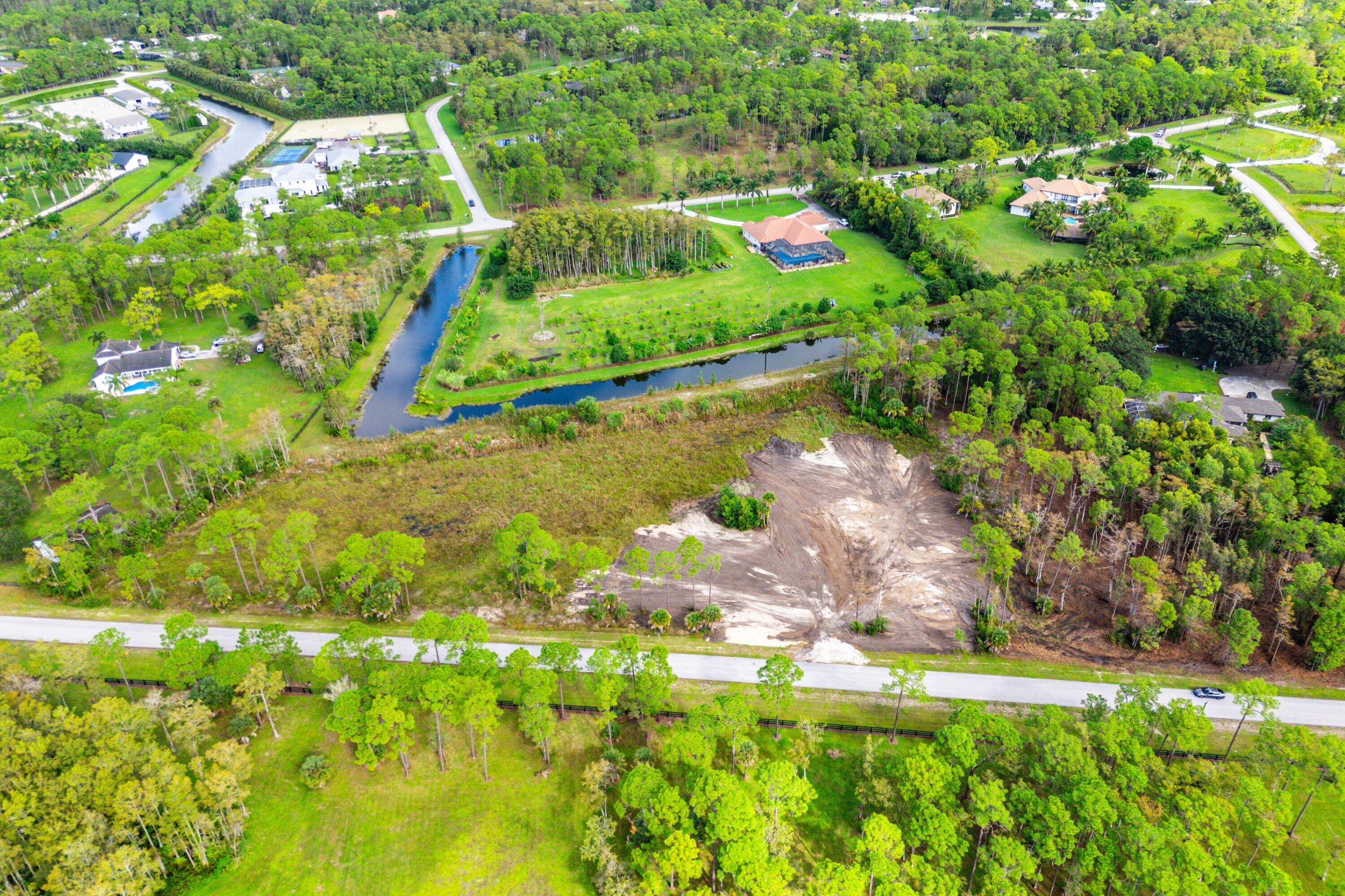 Discover this exceptional cleared 5 acre parcel in Homeland one of South Florida's most desirable equestrian communities.