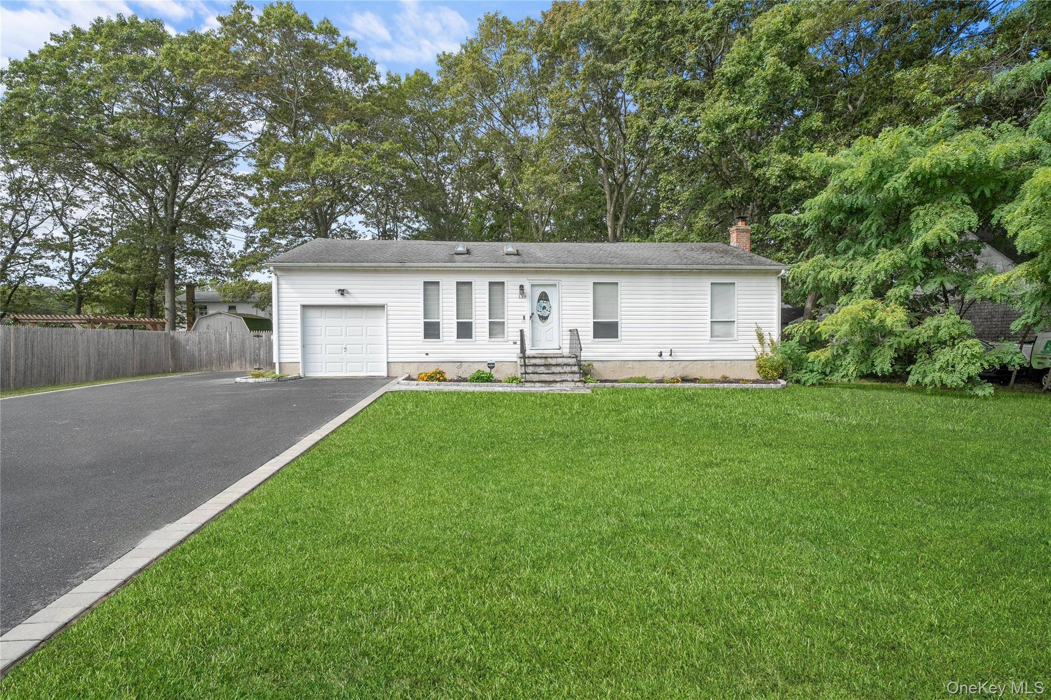 Welcome Home ! This lovely 3 bedroom ranch offers an open and airy feel with soaring high ceilings and newly updated skylights that fill the home with natural light.