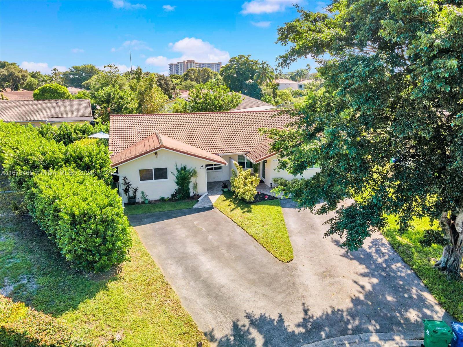 This renovated half duplex in Coral Springs features 3 bedrooms, 2 bathrooms, and a spacious driveway for up to 4 cars, plus a lovely garden patio.