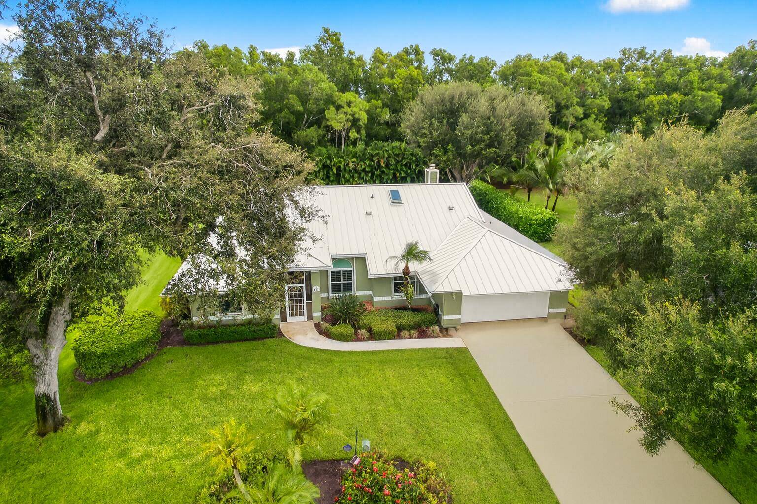 Enjoy this private half acre oasis in desirable Canoe Creek !