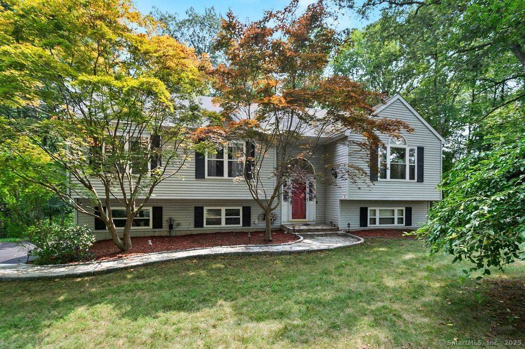 TRANQUILITY ABOUNDS ! Tucked away on a quiet cul de sac immersed in nature this Beautiful Expanded Contemporary Raised Ranch offers 3 Bedrooms, 2.