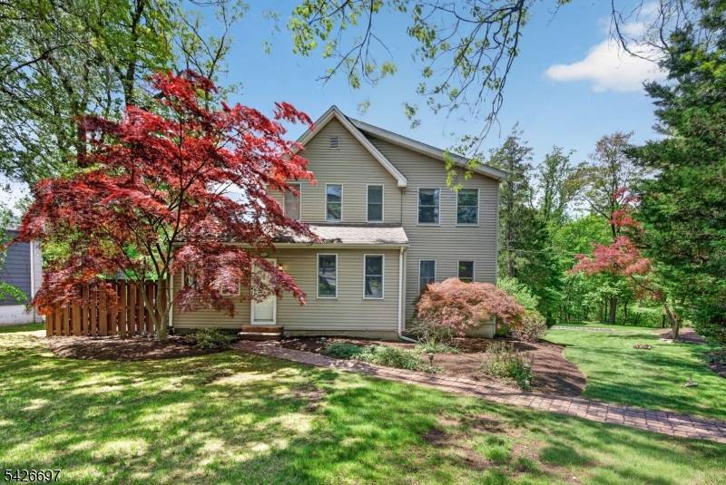Tucked away on a beautifully landscaped wooded lot, this wonderful colonial home on over half an acre offers the perfect blend of privacy and convenience just two blocks to the ...