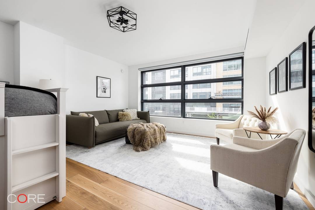 Bathed in warm western light, this thoughtfully designed studio feels like a true home from the moment you enter.