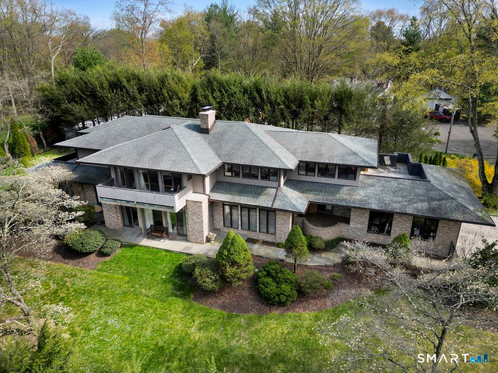 Nestled directly across from the peaceful, tree lined shores of Canoe Brook Lake, this exceptional home offers nearly 5, 000 square feet of luxurious, light filled living with lovely water ...