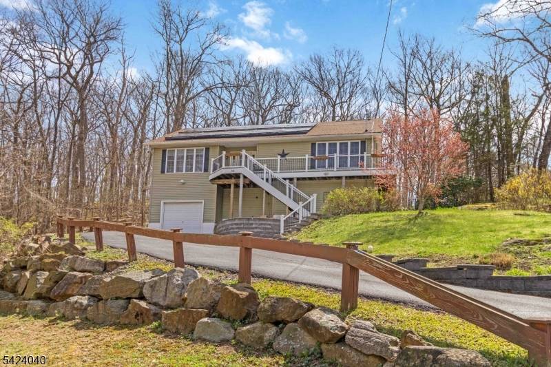 Spacious Expanded Cape offers a functional layout all set against a beautiful backdrop of natural privacy.