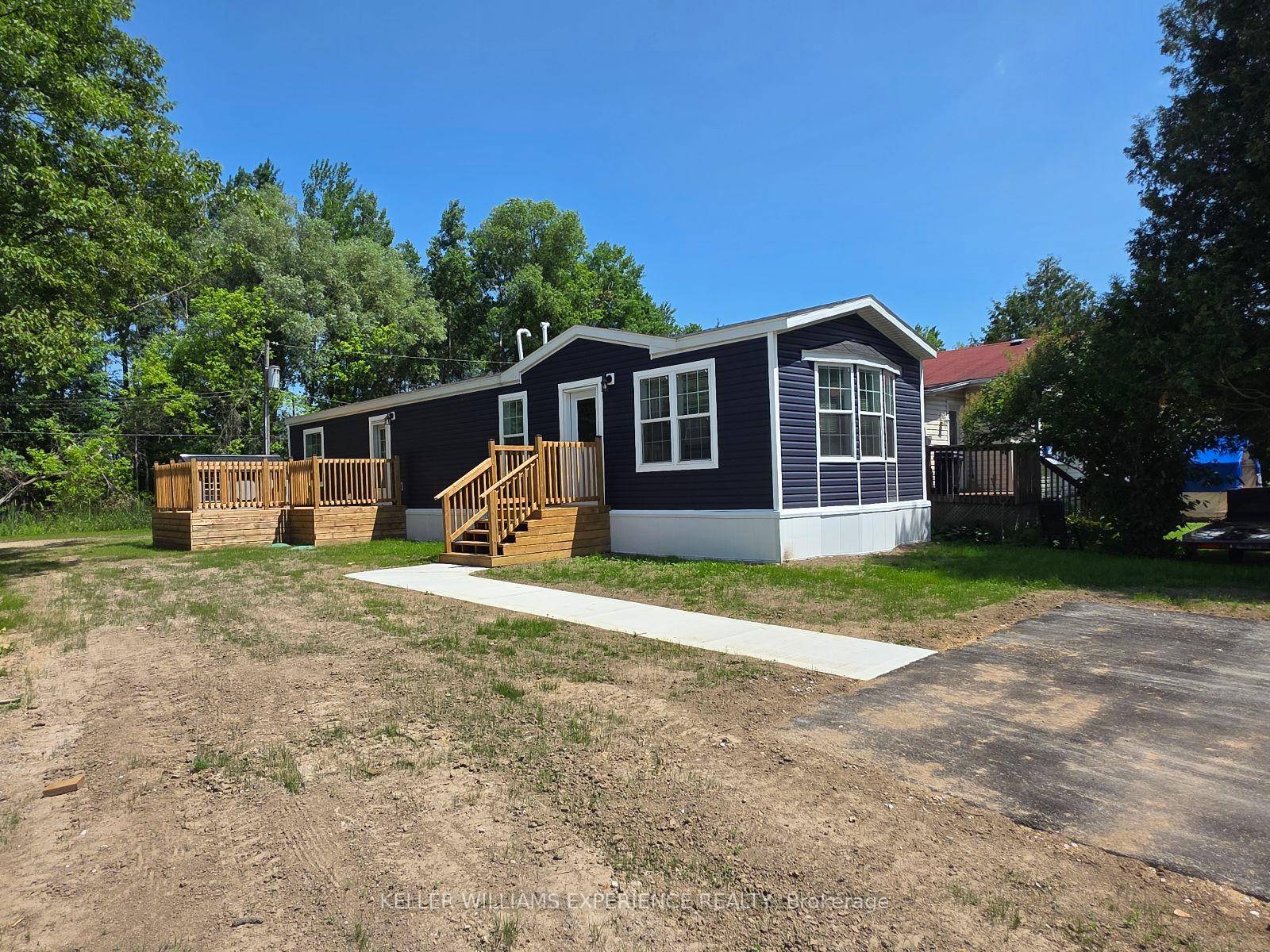 This brand new mobile home is situated in a quiet, well maintained park, offering a peaceful and convenient lifestyle.