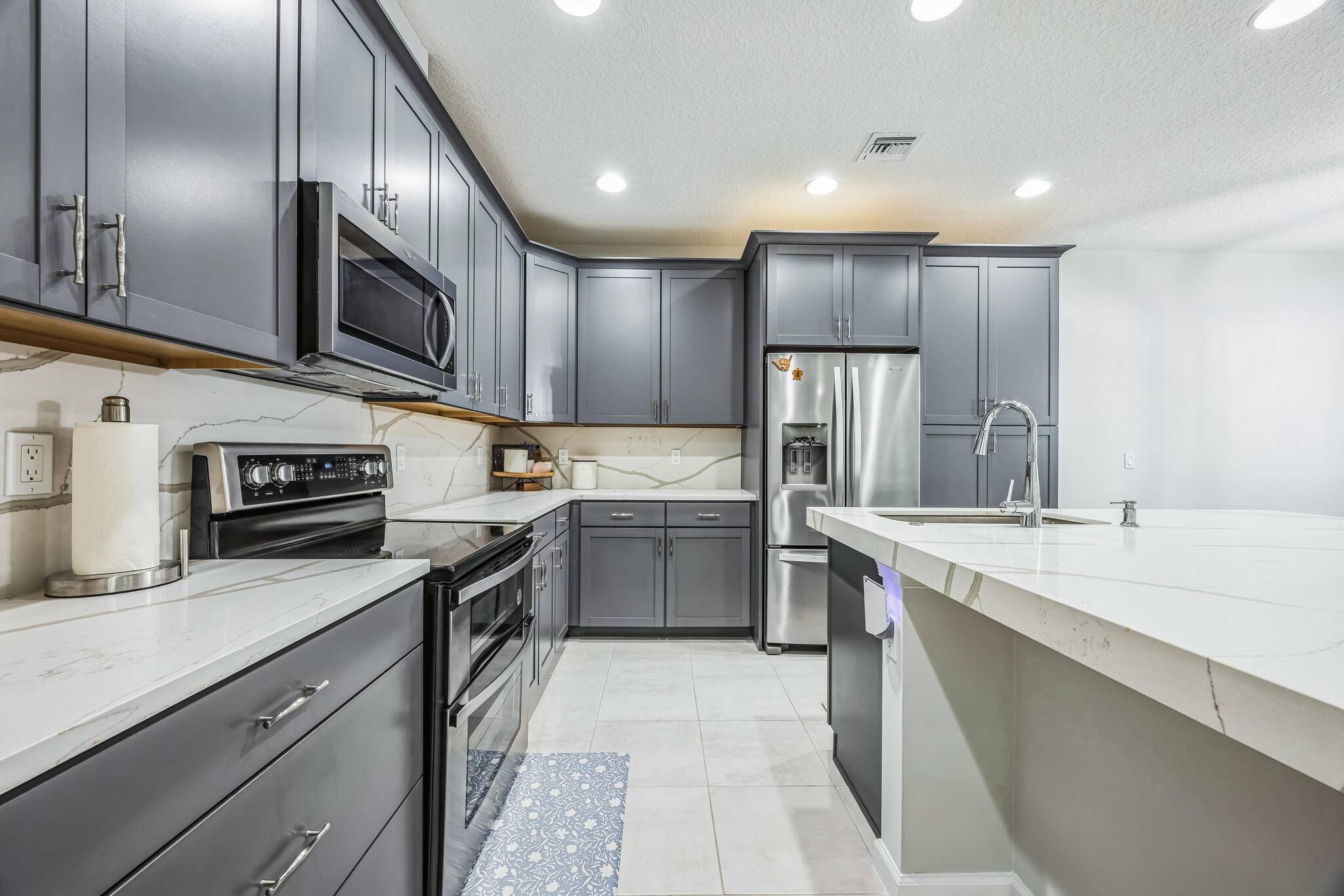 This beautiful 3 bedroom, 3 bath home offers an open floor plan filled with natural light, a modern kitchen with beautiful quartz countertops stainless appliances, and a spacious primary suite ...