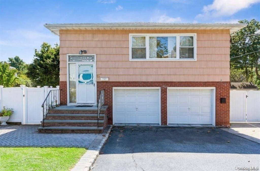 Welcome home to this stunning, fully remodeled hi ranch bi level home, offering a pristine full floor apartment.