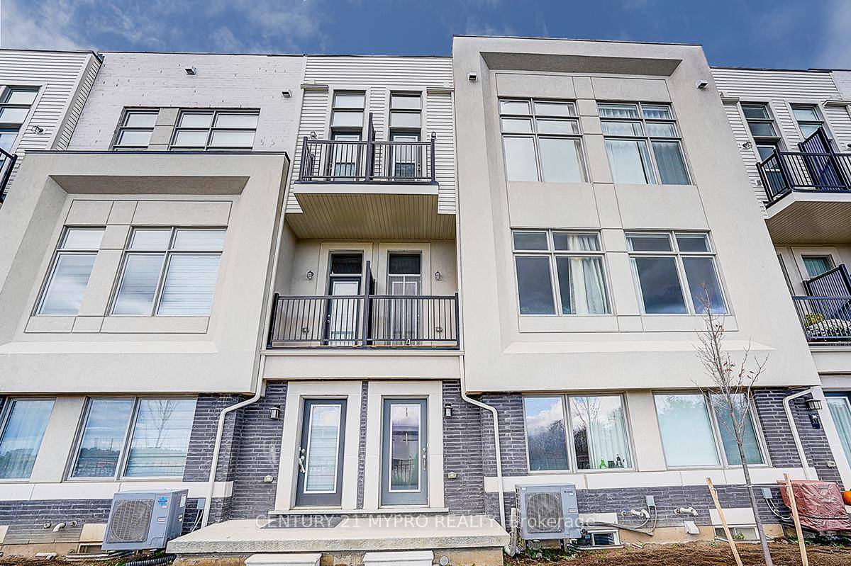 Stunning modern freehold townhouse with plot fee, featuring a built in double car garage, located in the Cachet community.