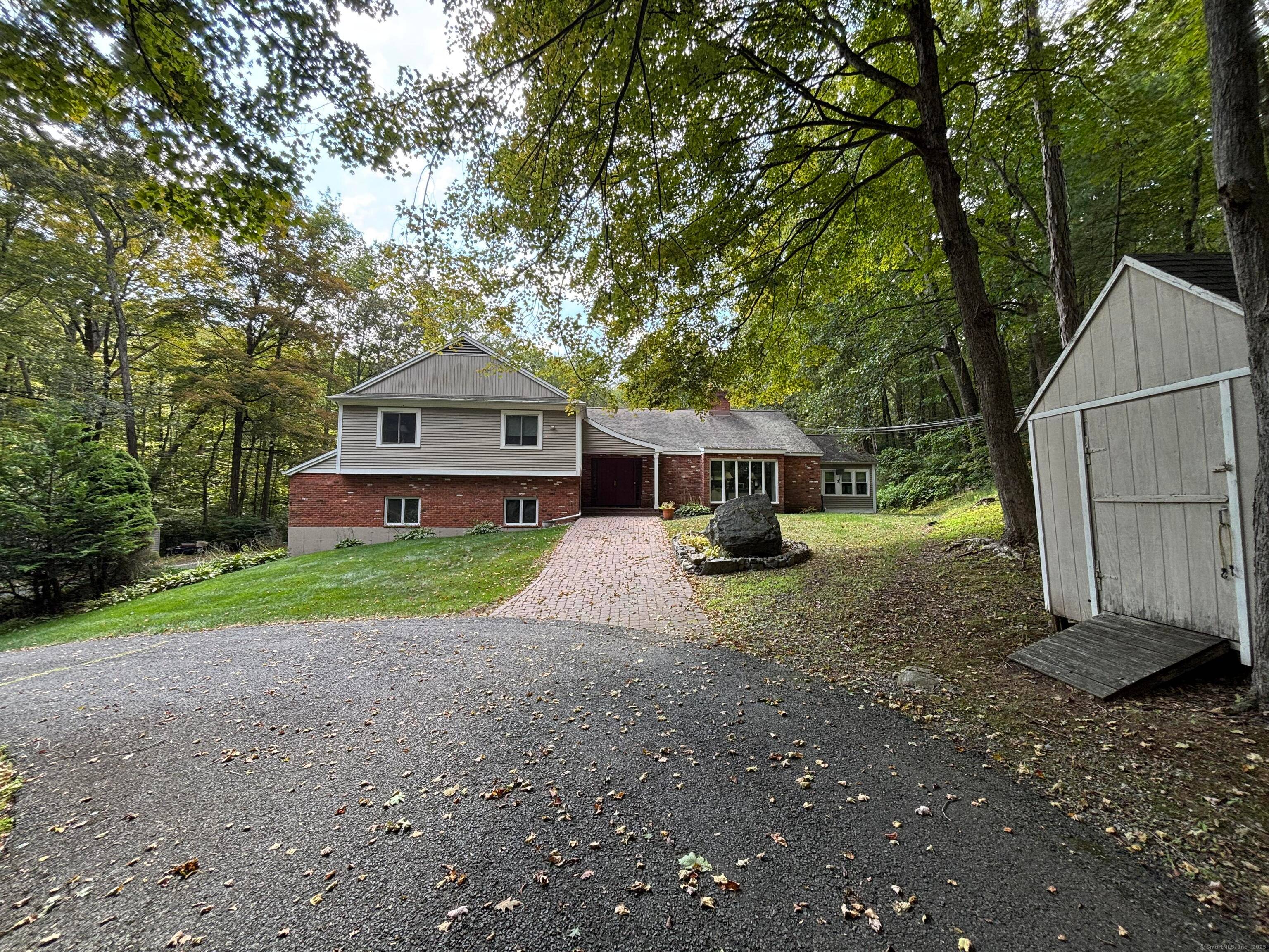 Discover your tranquil retreat at 80 Pine Hollow Drive !