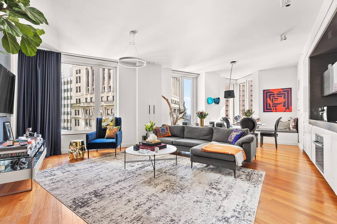 Residence 21E at 15 William Street is a spacious and light filled two bedroom, two bath home in one of Downtown Manhattan s premier full service condominiums.